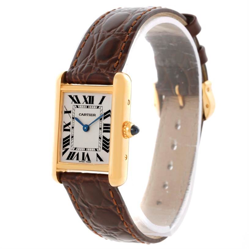The Cartier Tank Louis W1529856 Women's Yellow Gold Silver Dial W1529856 Women's Yellow Gold Silver Dial watch is shown in a side-angle view, highlighting the leather strap, rectangular case, and crown with a cabochon.