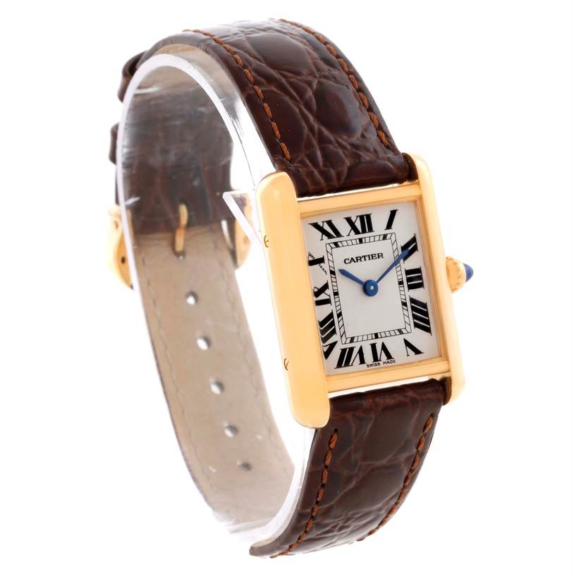 The image shows a Cartier Tank Louis W1529856 Women's Yellow Gold Silver Dial W1529856 Women's Yellow Gold Silver Dial watch at a three-quarter angle, highlighting its face, brown leather strap, and gold case.
