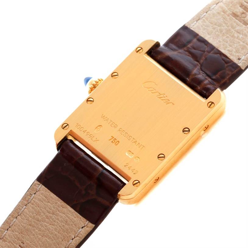 The image shows the back of a Cartier Tank Louis W1529856 Women's Yellow Gold Silver Dial W1529856 Women's Yellow Gold Silver Dial watch, featuring its gold case and leather straps.