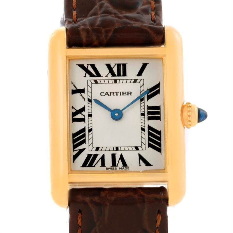 The image shows a front view of a Cartier Tank Louis W1529856 Women's Yellow Gold Silver Dial W1529856 Women's Yellow Gold Silver Dial watch, highlighting its rectangular face, roman numerals, and brown leather strap.