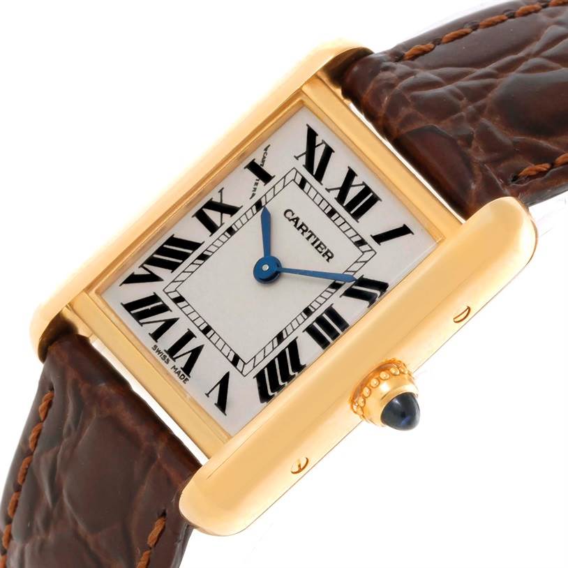 The image shows a close-up of a Cartier Tank Louis W1529856 Women's Yellow Gold Silver Dial W1529856 Women's Yellow Gold Silver Dial watch face, showcasing the dial, Roman numerals, and part of the leather strap.