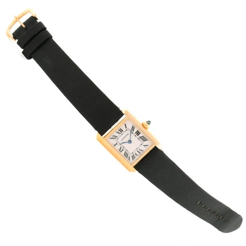 The image shows a Cartier Tank Louis W1529856 Women's Yellow Gold Silver Dial W1529856 Women's Yellow Gold Silver Dial watch laid flat, displaying its face, straps, and buckle from a top view.