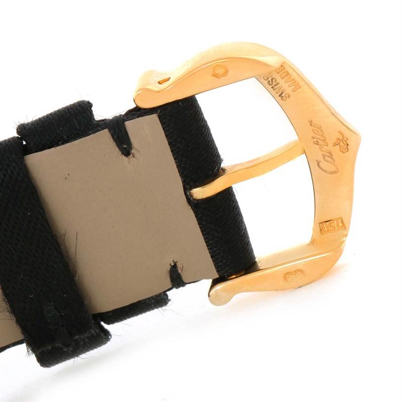 This close-up image shows the gold buckle and part of the strap of the Cartier Tank Louis W1529856 Women's Yellow Gold Silver Dial W1529856 Women's Yellow Gold Silver Dial watch.