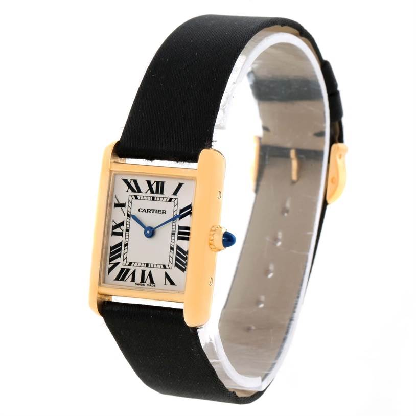 The image shows a Cartier Tank Louis W1529856 Women's Yellow Gold Silver Dial W1529856 Women's Yellow Gold Silver Dial watch at a slight angle, highlighting its rectangular face, roman numerals, blue hands, and leather strap.
