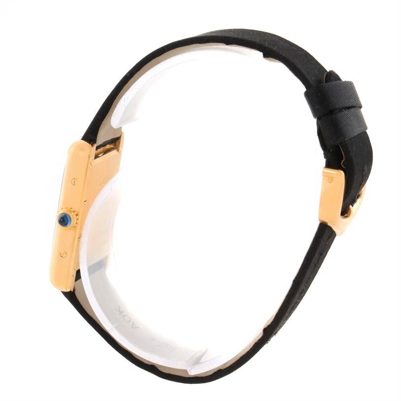 This image shows a side view of the Cartier Tank Louis W1529856 Women's Yellow Gold Silver Dial W1529856 Women's Yellow Gold Silver Dial model watch, highlighting its crown and strap.