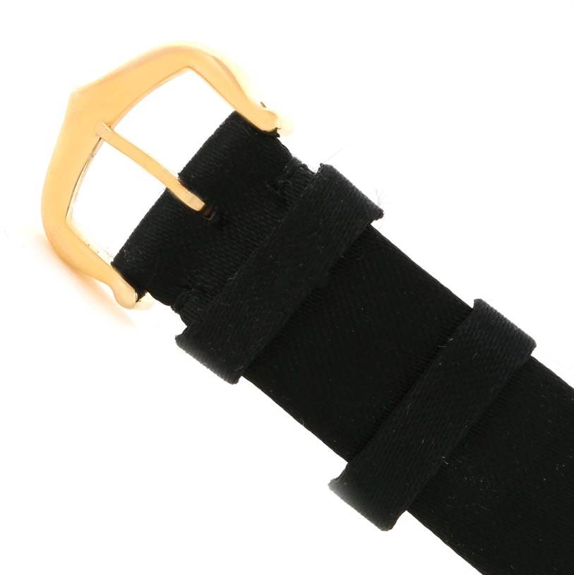 This image shows the buckle and part of the black leather strap of the Cartier Tank Louis W1529856 Women's Yellow Gold Silver Dial W1529856 Women's Yellow Gold Silver Dial watch.