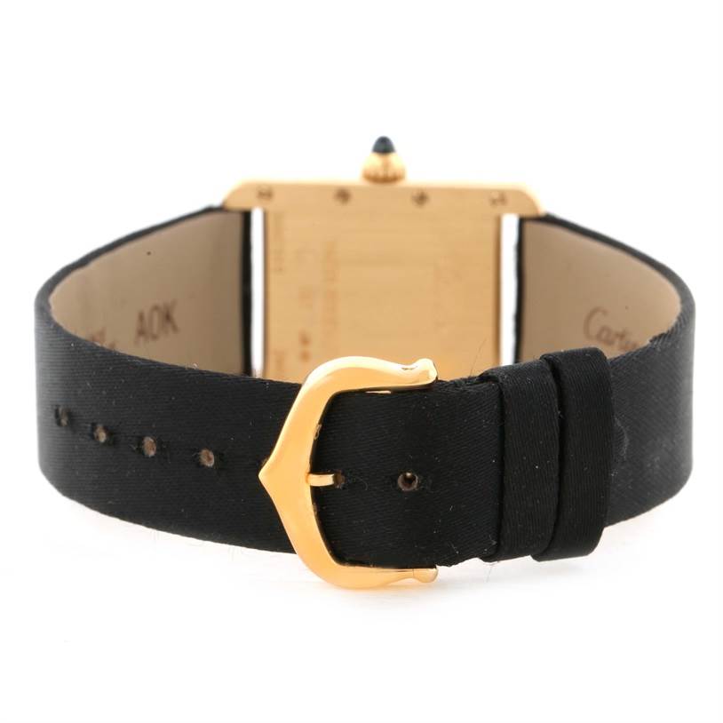 The image shows the back of a Cartier Tank Louis W1529856 Women's Yellow Gold Silver Dial W1529856 Women's Yellow Gold Silver Dial watch, focusing on the black leather strap and gold buckle.