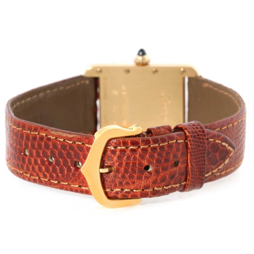 The image shows the back of a Cartier Tank Louis W1529856 Women's Yellow Gold Silver Dial W1529856 Women's Yellow Gold Silver Dial watch, focusing on the leather strap and the clasp.