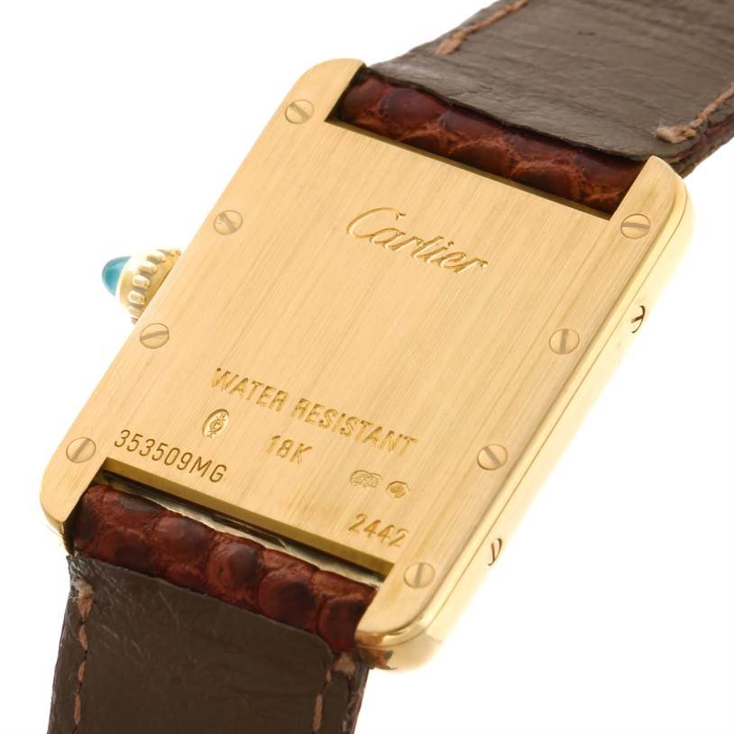 The image shows the back and leather strap of a Cartier Tank Louis W1529856 Women's Yellow Gold Silver Dial W1529856 Women's Yellow Gold Silver Dial watch at an angled view.