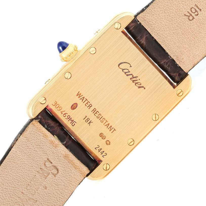 This image shows the back of a Cartier Tank Louis W1529856 Women's Yellow Gold Silver Dial W1529856 Women's Yellow Gold Silver Dial watch, highlighting its water resistance and 18K gold details.
