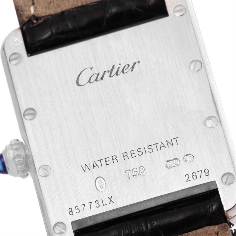 This image shows the case back of a Cartier Tank Louis W1541056 Women's White Gold Silver Dial W1541056 Women's White Gold Silver Dial watch, displaying branding, water resistance, and serial information.