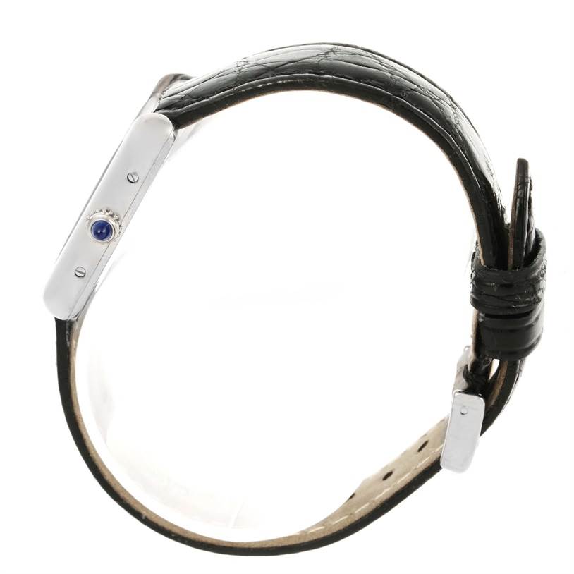 The image shows a side angle of the Cartier Tank Louis W1541056 Women's White Gold Silver Dial W1541056 Women's White Gold Silver Dial model watch, highlighting the crown and leather strap.