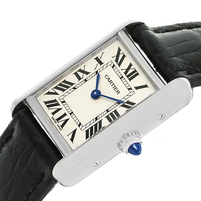 The image shows a Cartier Tank Louis W1541056 Women's White Gold Silver Dial W1541056 Women's White Gold Silver Dial watch at an angle, highlighting its rectangular face, Roman numerals, blue hands, and black leather strap.