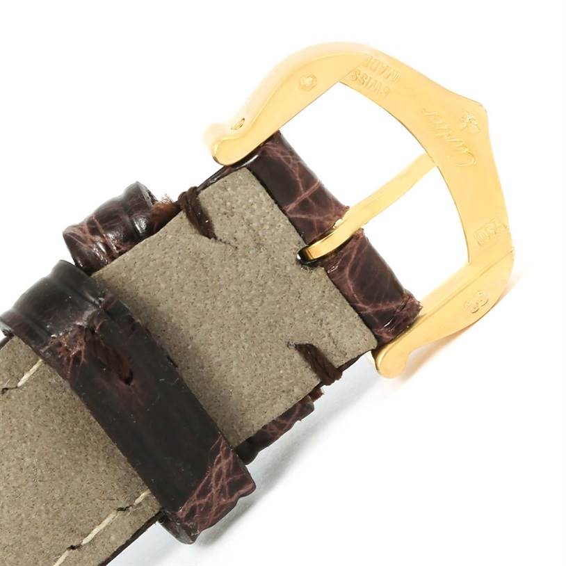 The image shows a close-up of the buckle and leather strap of a Cartier Tank Louis W1529856 Women's Yellow Gold Silver Dial W1529856 Women's Yellow Gold Silver Dial model watch.