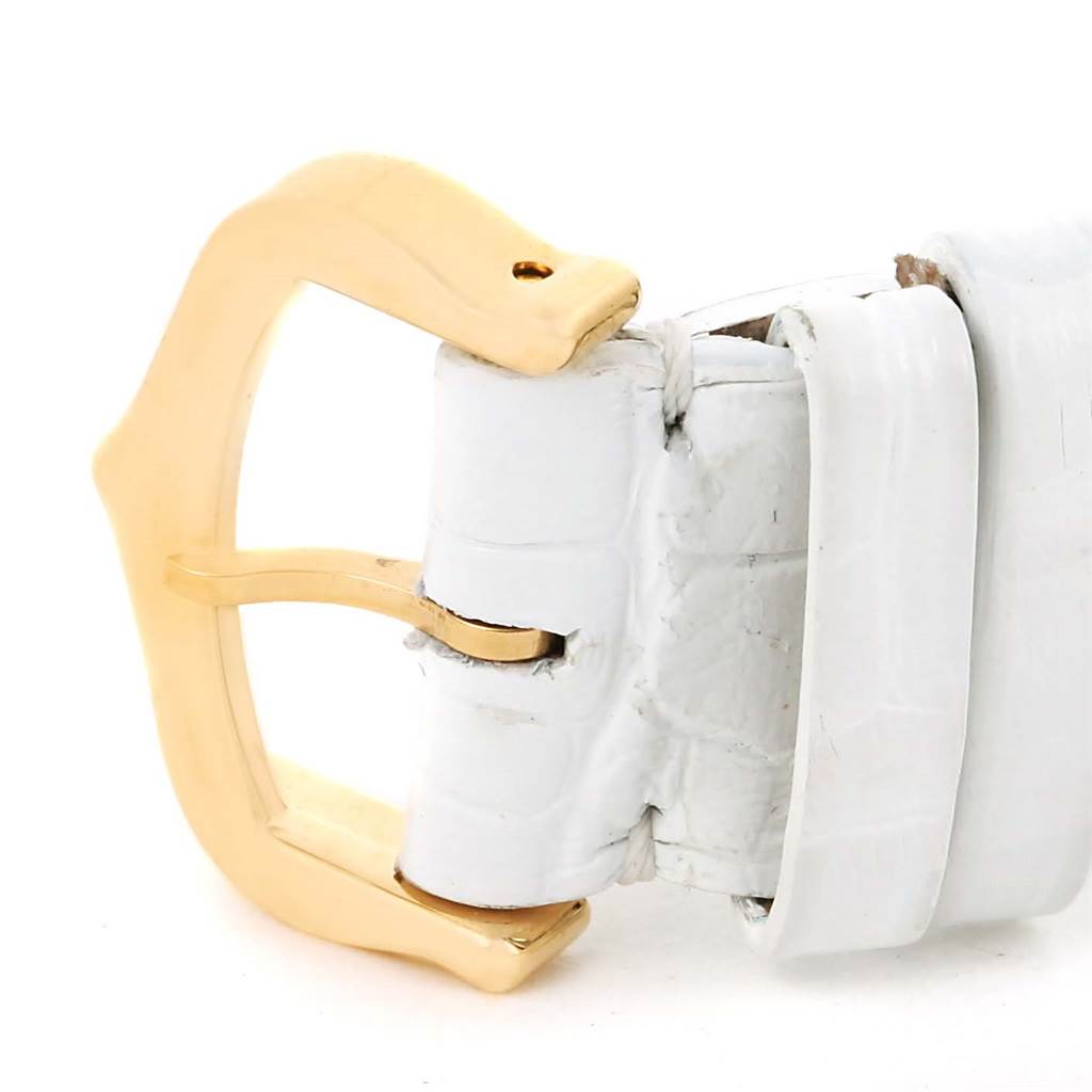 The image shows a close-up of the white leather strap and gold buckle of a Cartier Tank Louis W1529756 Women's Yellow Gold Silver Dial W1529756 Women's Yellow Gold Silver Dial watch.