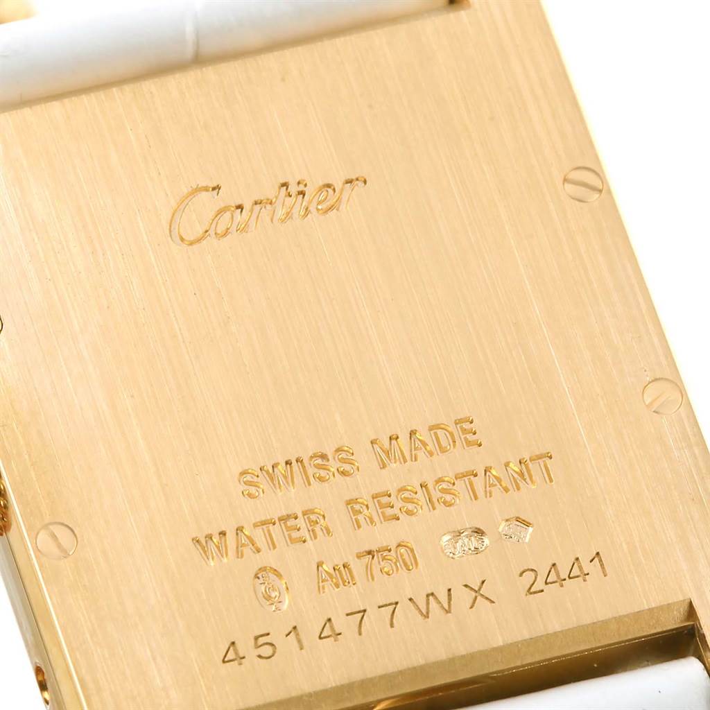 The image shows the back case of a Cartier Tank Louis W1529756 Women's Yellow Gold Silver Dial W1529756 Women's Yellow Gold Silver Dial watch with engravings.