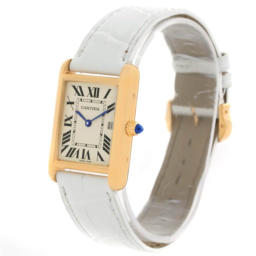 The Cartier Tank Louis W1529756 Women's Yellow Gold Silver Dial W1529756 Women's Yellow Gold Silver Dial model watch is shown at a slightly tilted angle, highlighting its face, crown, and white leather strap.