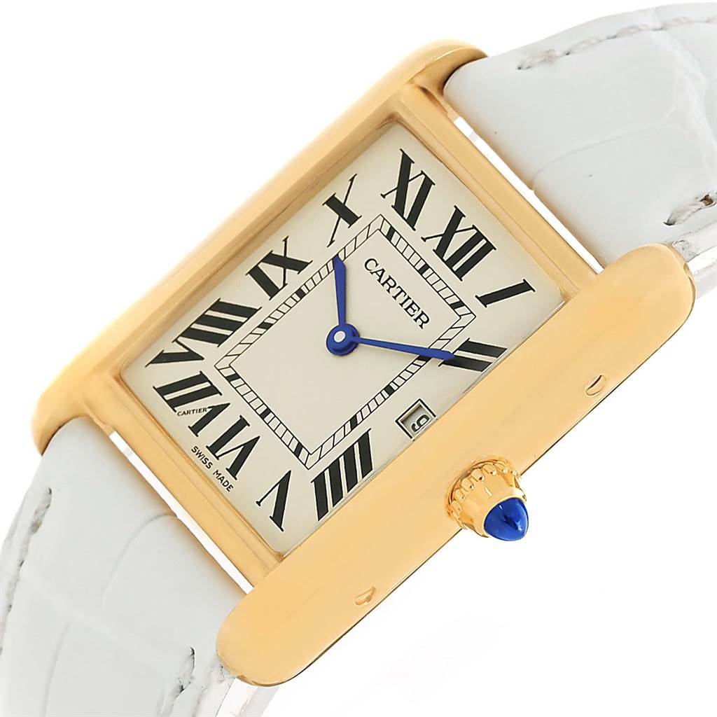 The image shows a Cartier Tank Louis W1529756 Women's Yellow Gold Silver Dial W1529756 Women's Yellow Gold Silver Dial watch from a tilted angle, highlighting its face, blue hands, date window, and white strap.