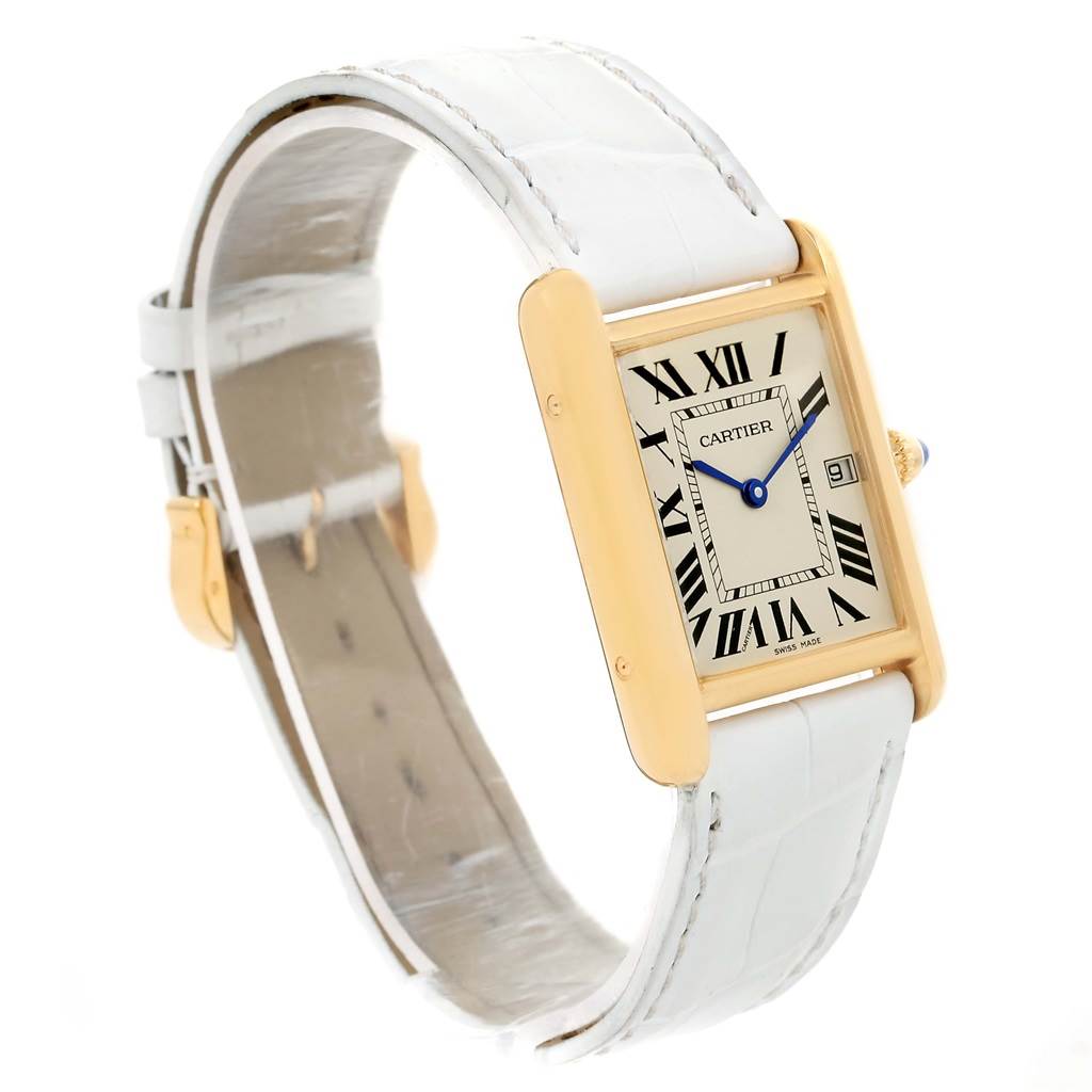 This image shows a side angle view of the Cartier Tank Louis W1529756 Women's Yellow Gold Silver Dial W1529756 Women's Yellow Gold Silver Dial watch, featuring its rectangular face, gold case, white strap, and Roman numeral dial.