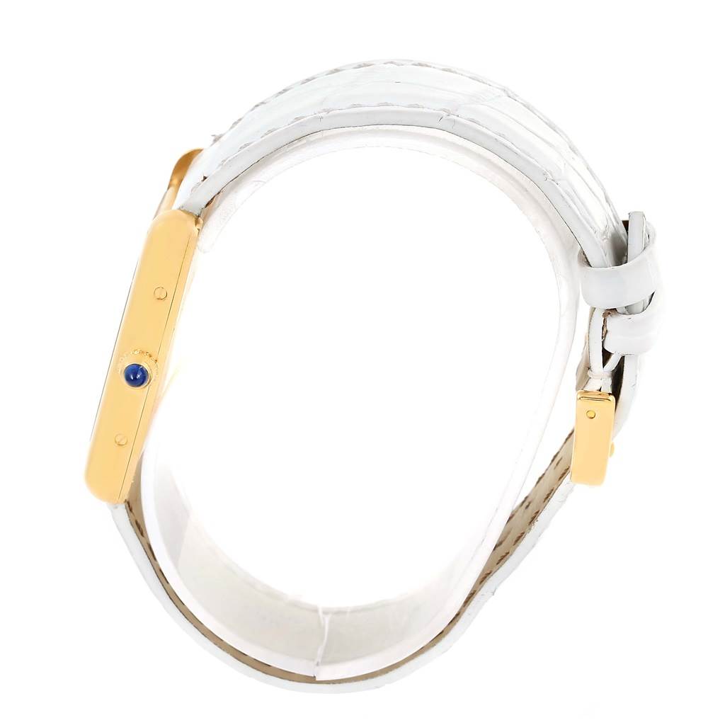 This image shows the side view of the case and white leather strap of the Cartier Tank Louis W1529756 Women's Yellow Gold Silver Dial W1529756 Women's Yellow Gold Silver Dial watch.