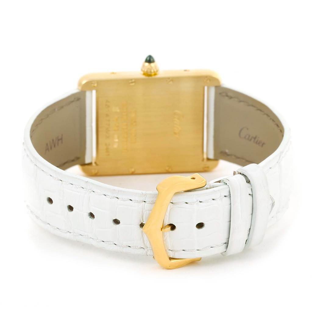 The image shows the back of a Cartier Tank Louis W1529756 Women's Yellow Gold Silver Dial W1529756 Women's Yellow Gold Silver Dial watch, highlighting its white leather strap and gold buckle.