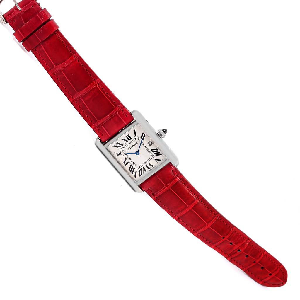 The image shows a Cartier Tank Louis W1540956 White Gold Silver Dial W1540956 White Gold Silver Dial watch with a rectangular face and red leather strap, viewed from a top-down angle.