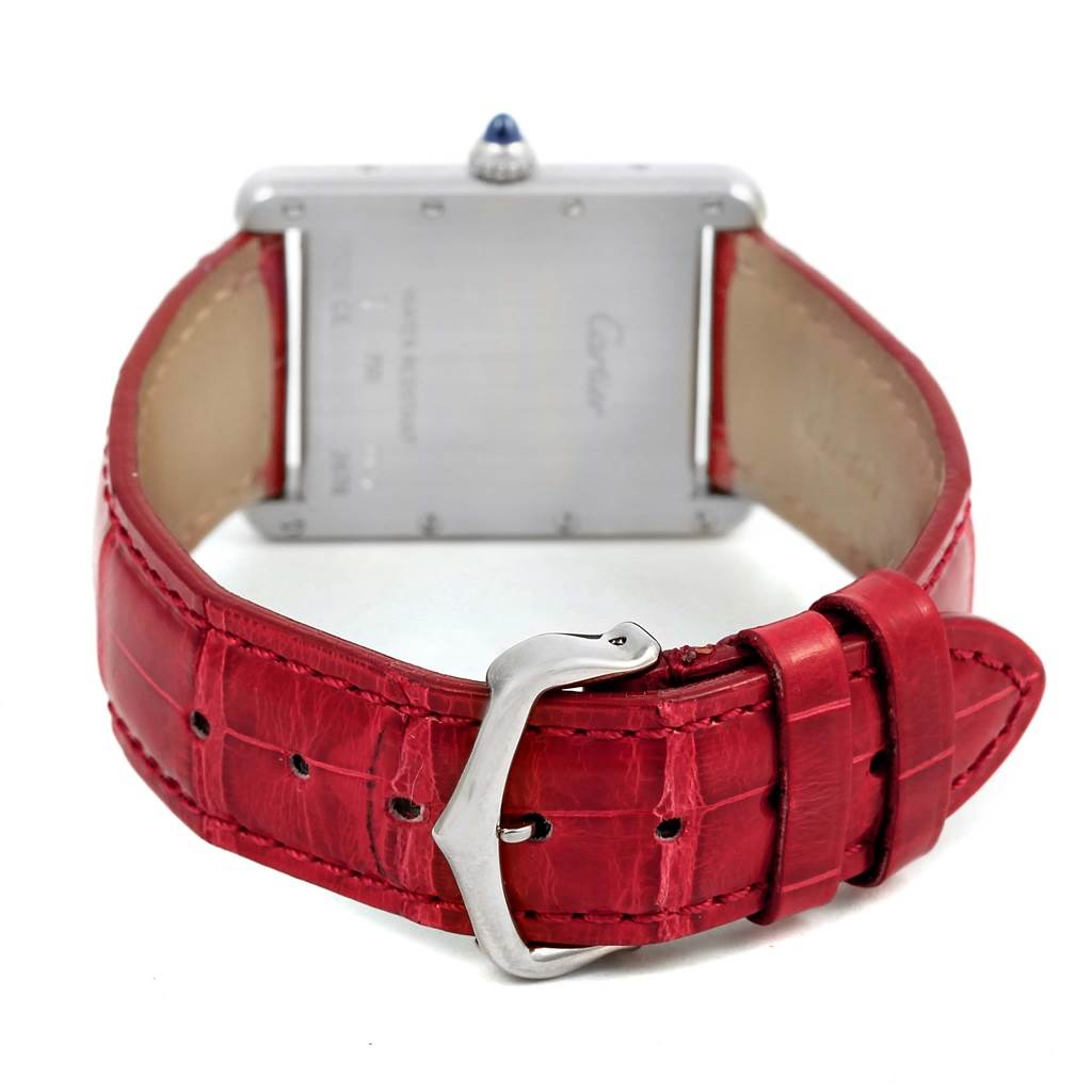 The image shows the back and buckle of the Cartier Tank Louis W1540956 White Gold Silver Dial W1540956 White Gold Silver Dial watch with a red leather strap.
