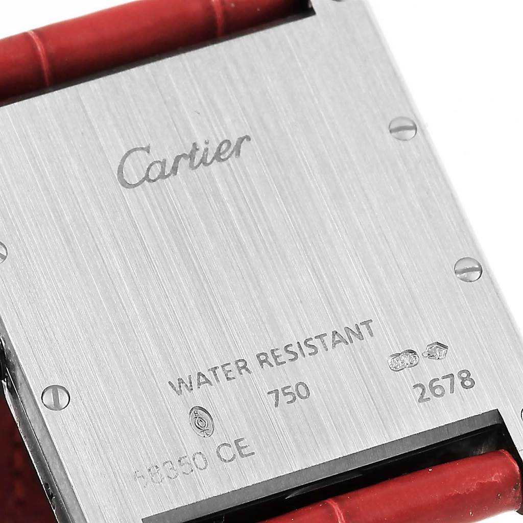 The image shows the back case and part of the strap of a Tank Louis model by Cartier.