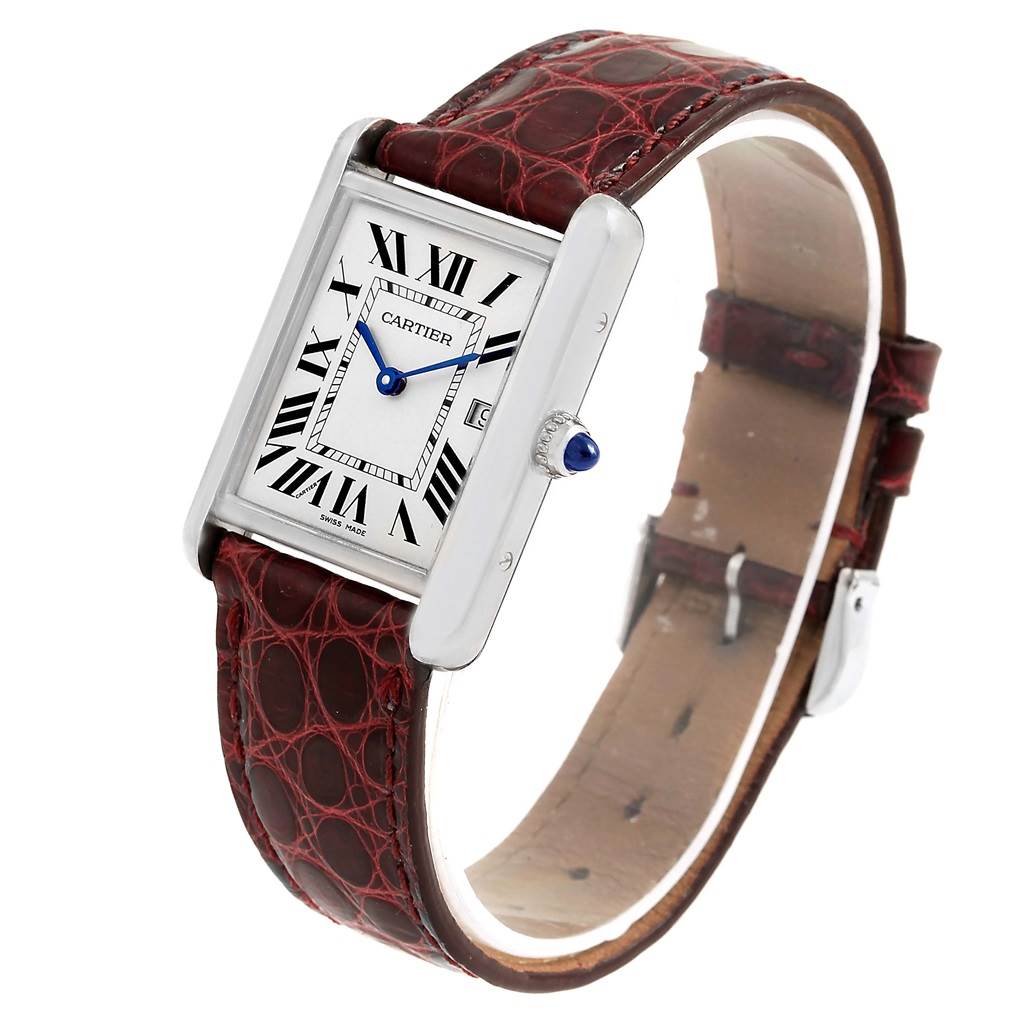 The Cartier Tank Louis W1540956 White Gold Silver Dial W1540956 White Gold Silver Dial watch is shown at a slight angle, displaying its face, Roman numerals, strap, and crown with a blue cabochon.