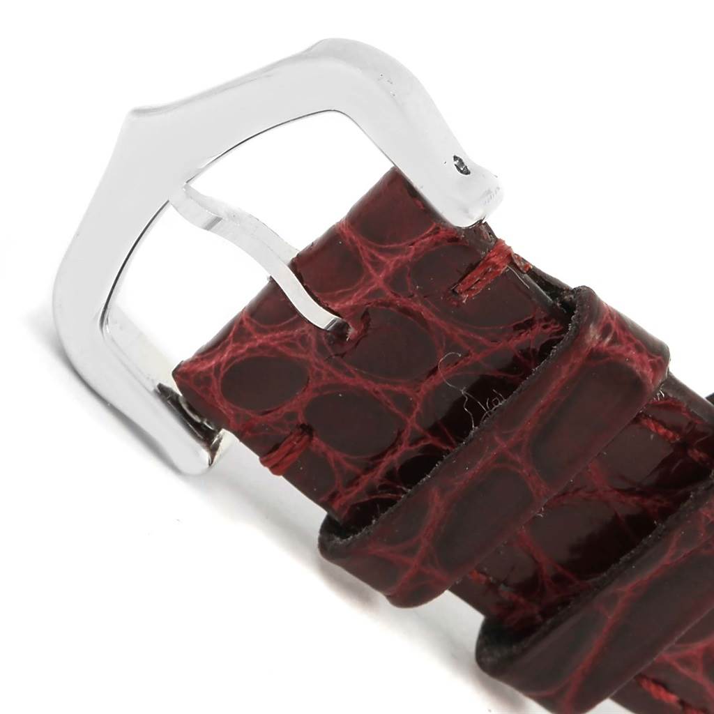 This image shows a close-up of the strap and buckle of the Cartier Tank Louis W1540956 White Gold Silver Dial W1540956 White Gold Silver Dial watch, highlighting the leather texture and metal buckle.