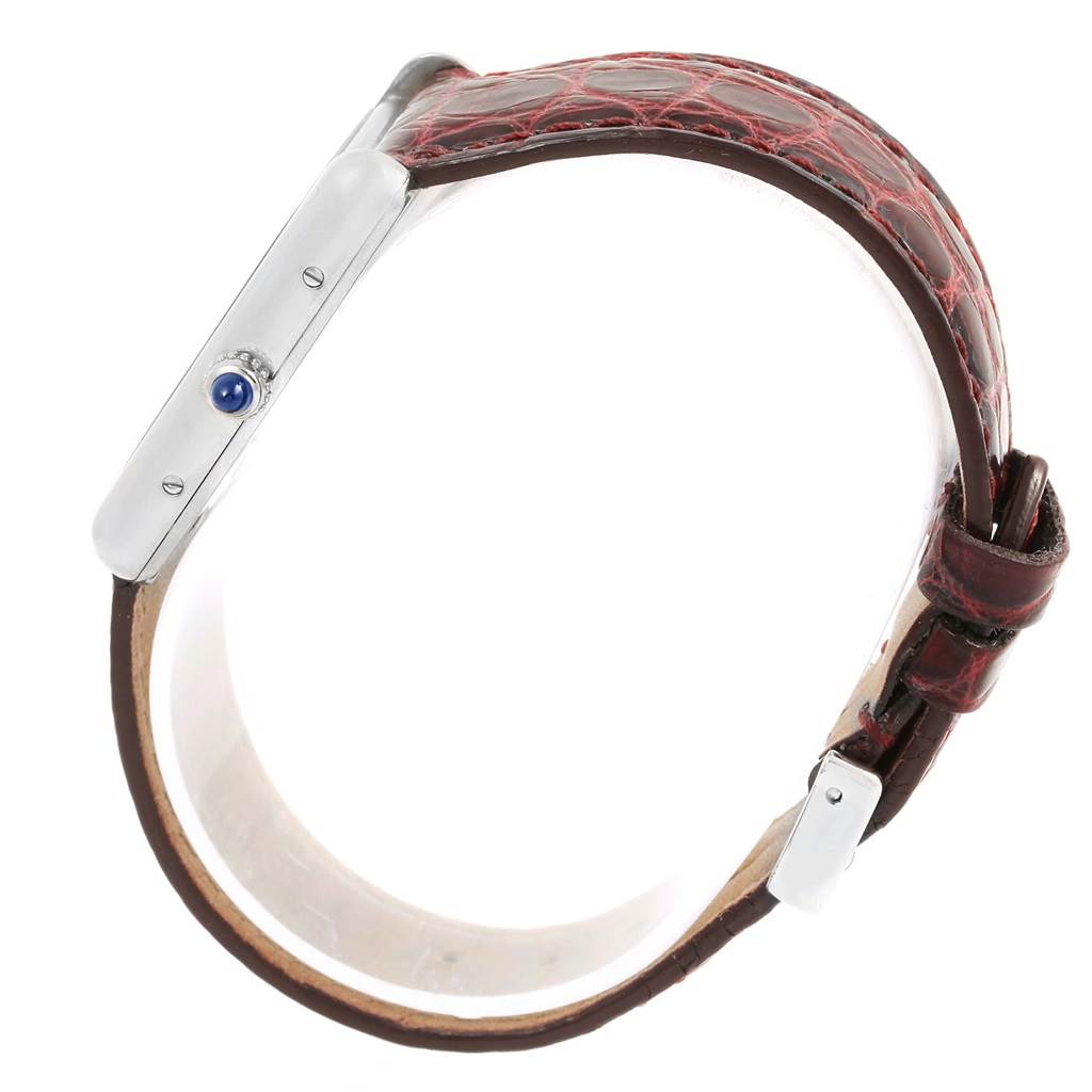 The image shows a side view of the Cartier Tank Louis W1540956 White Gold Silver Dial W1540956 White Gold Silver Dial watch, highlighting the crown and brown leather strap.