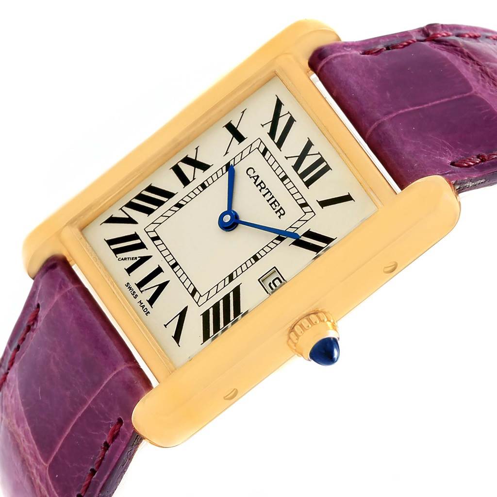 The image shows a Tank Louis model watch by Cartier from an angled view, highlighting its dial, hands, crown, and strap.