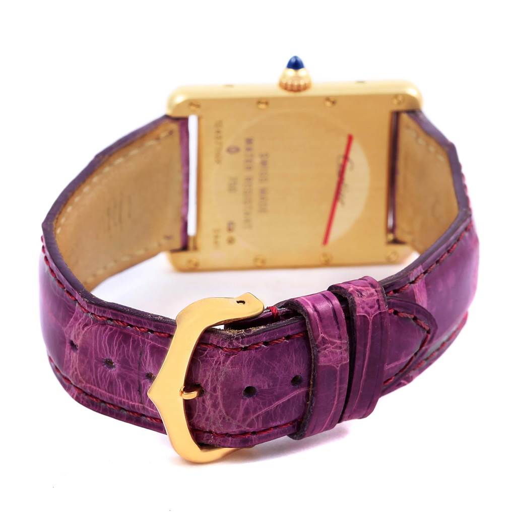 The image shows the back of the Cartier Tank Louis W1529756 Yellow Gold Silver Dial W1529756 Yellow Gold Silver Dial watch with a purple leather strap and gold buckle.