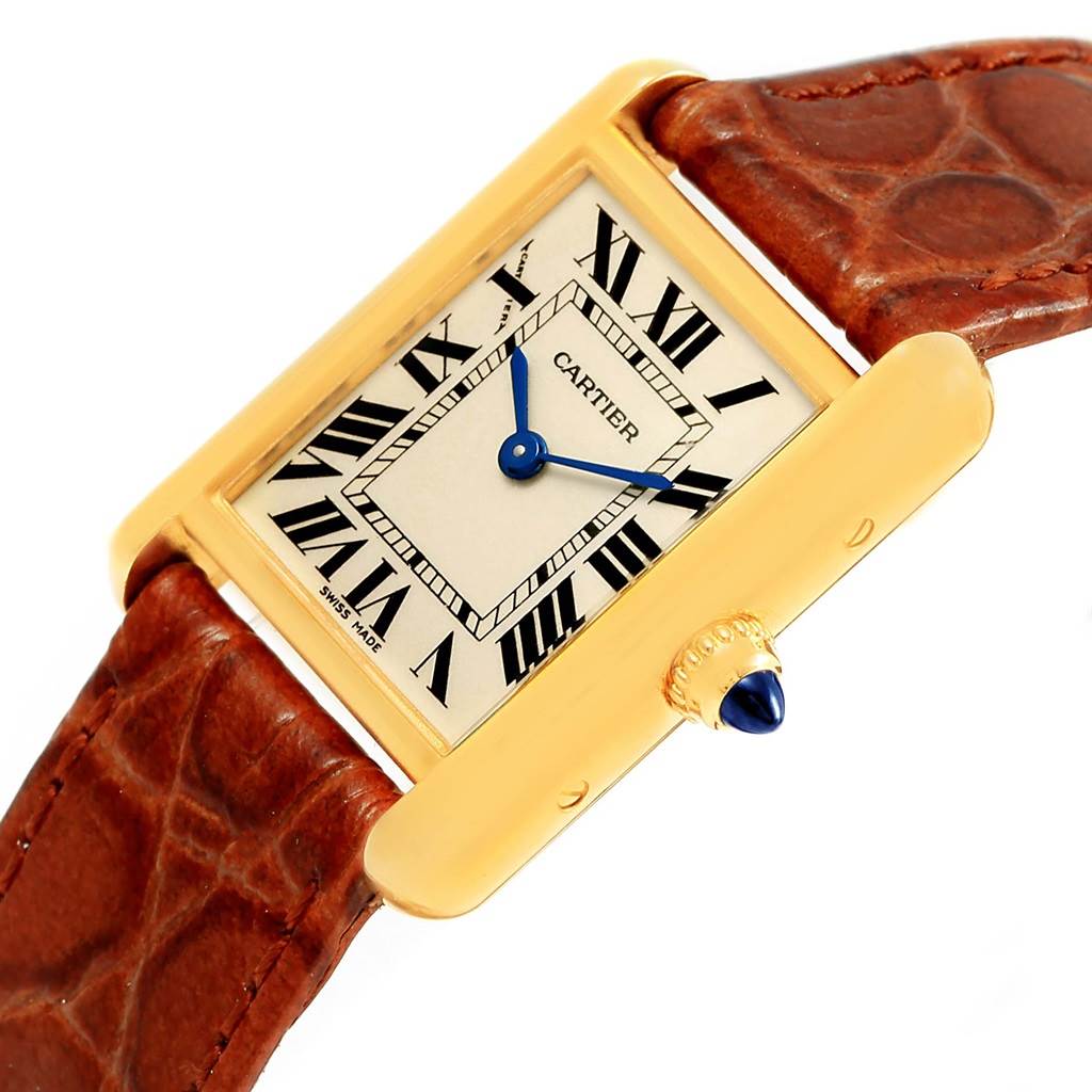 This image shows a Tank Louis model by Cartier from a top-angle view, highlighting the watch face and a portion of the leather strap.