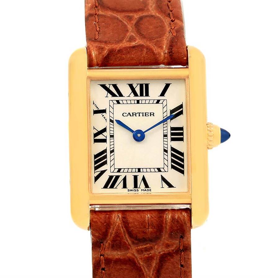 The image shows a straight-on view of the Cartier Tank Louis watch, highlighting its rectangular dial, Roman numerals, and leather strap.