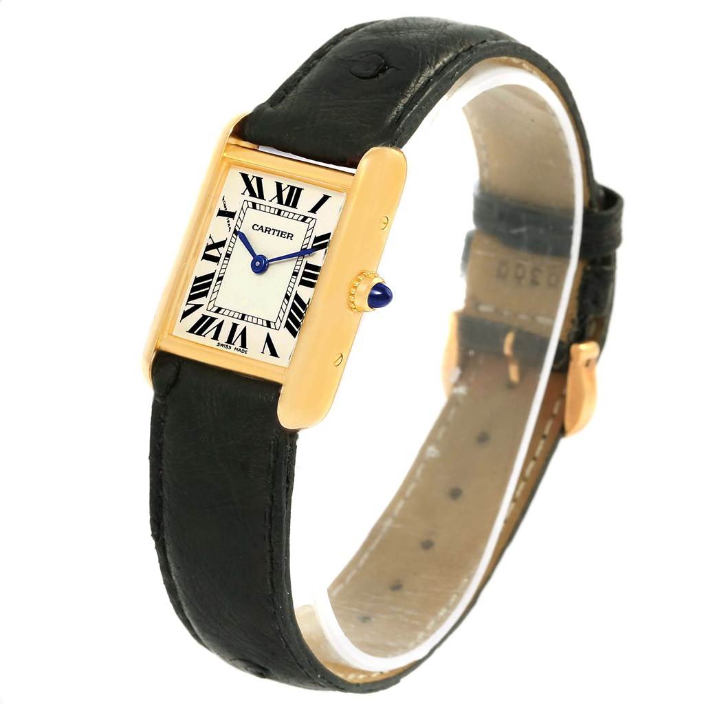 The image shows a Cartier Tank Louis W1529856 Women's Yellow Gold Silver Dial W1529856 Women's Yellow Gold Silver Dial watch angled to display its face, black leather strap, and gold case with the crown detail.