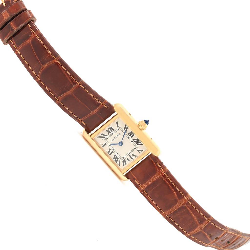 This image shows a Cartier Tank Louis W1529856 Women's Yellow Gold Silver Dial W1529856 Women's Yellow Gold Silver Dial watch at an angled top-down view, displaying the face, case, and brown leather strap.