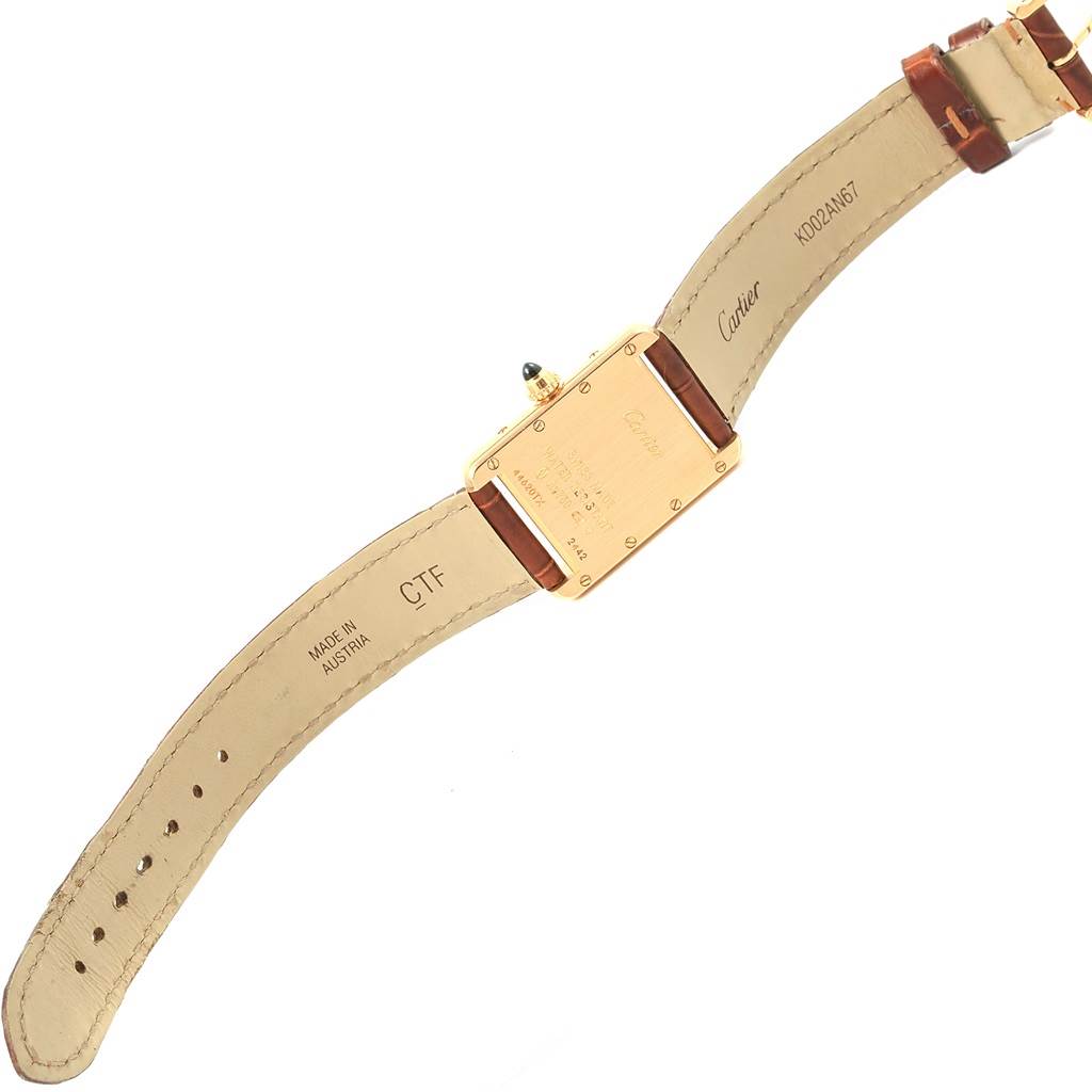 This image shows the back view of the Cartier Tank Louis W1529856 Women's Yellow Gold Silver Dial W1529856 Women's Yellow Gold Silver Dial watch with its leather strap fully extended.