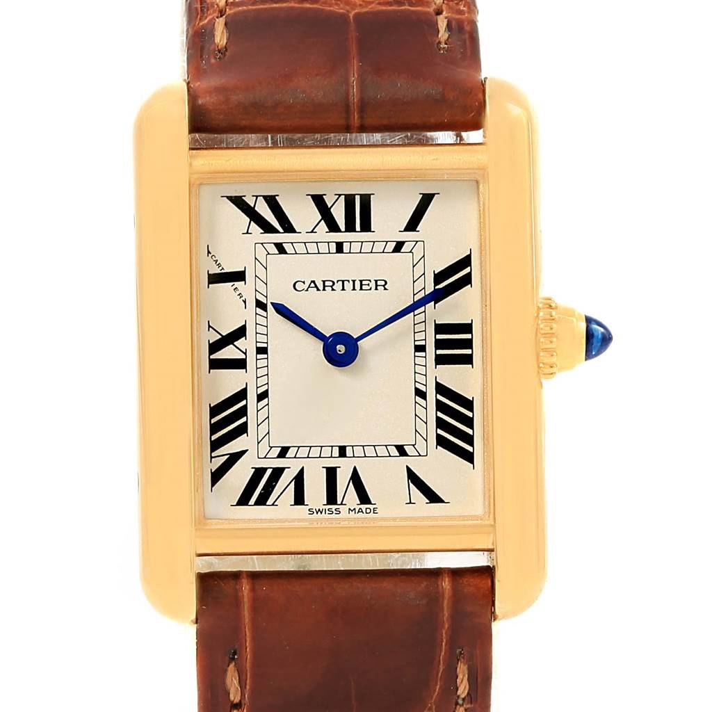 This image shows a frontal view of a Cartier Tank Louis W1529856 Women's Yellow Gold Silver Dial W1529856 Women's Yellow Gold Silver Dial watch, with a rectangular gold case, white dial, Roman numerals, and brown leather strap.