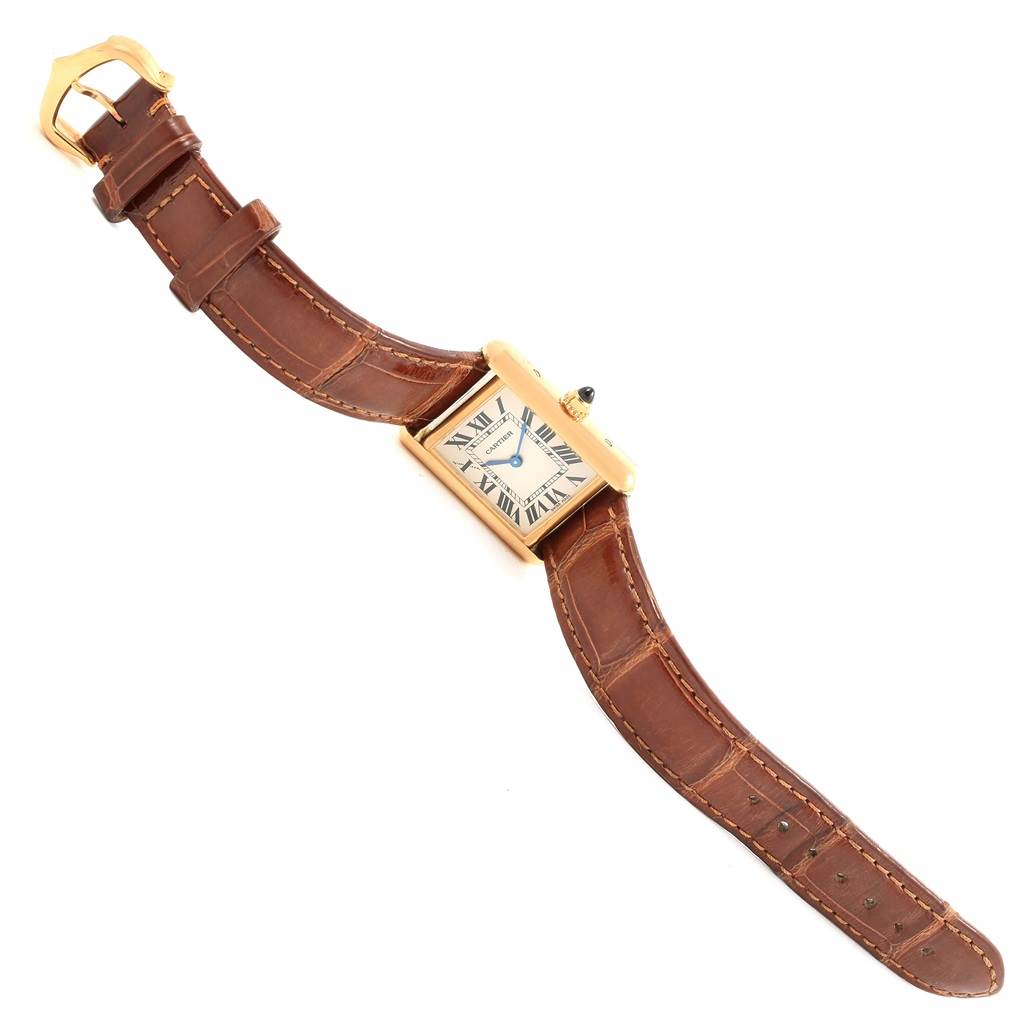 The image shows a Cartier Tank Louis W1529856 Women's Yellow Gold Silver Dial W1529856 Women's Yellow Gold Silver Dial watch from a top-down angle, displaying the watch face and brown leather strap.