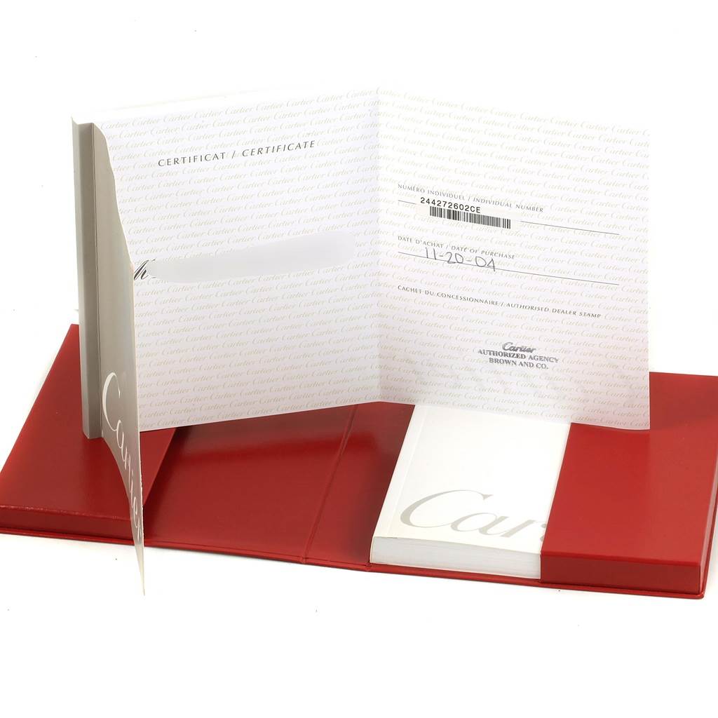 The image shows the certificate and booklet for a Cartier Tank Louis W1529856 Women's Yellow Gold Silver Dial W1529856 Women's Yellow Gold Silver Dial watch, displayed inside a red folder.