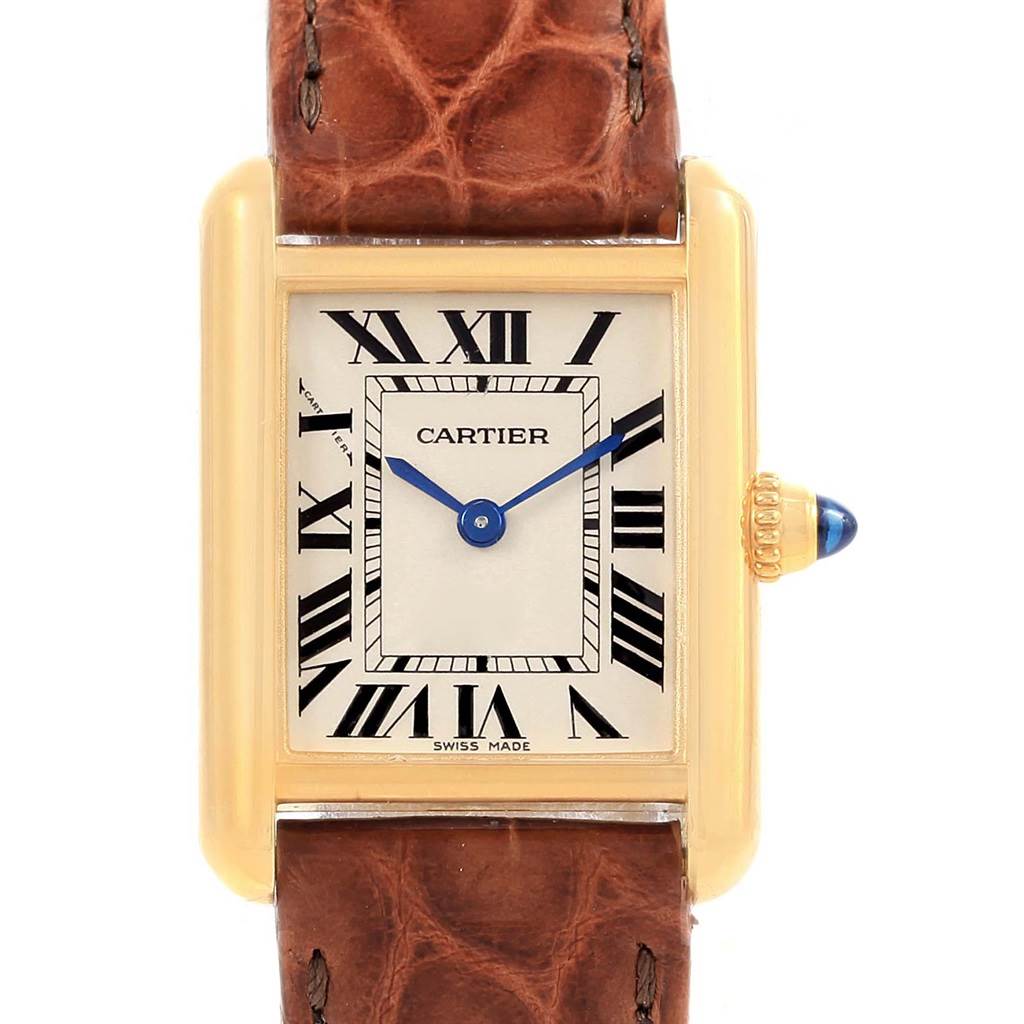 The image shows a front view of the Cartier Tank Louis W1529856 Women's Yellow Gold Silver Dial W1529856 Women's Yellow Gold Silver Dial watch, highlighting its rectangular dial, gold casing, and leather strap.
