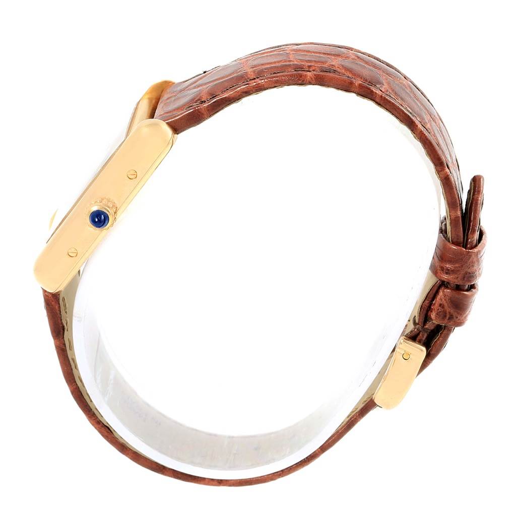 The image shows a side view of a Cartier Tank Louis W1529856 Women's Yellow Gold Silver Dial W1529856 Women's Yellow Gold Silver Dial watch, displaying the crown and leather strap.