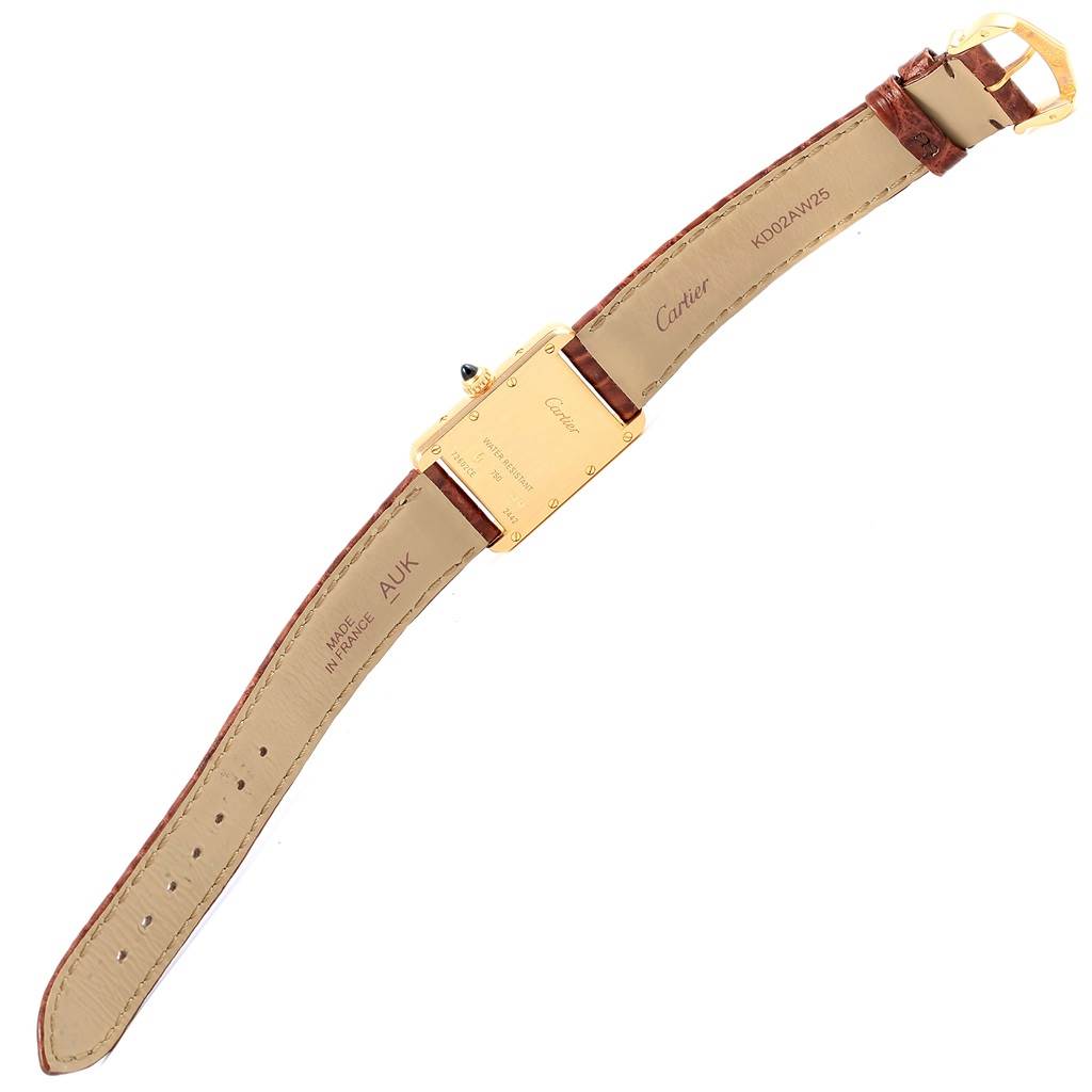 The image shows the back and underside of a Cartier Tank Louis W1529856 Women's Yellow Gold Silver Dial W1529856 Women's Yellow Gold Silver Dial watch with the strap fully extended, displaying the case back details.