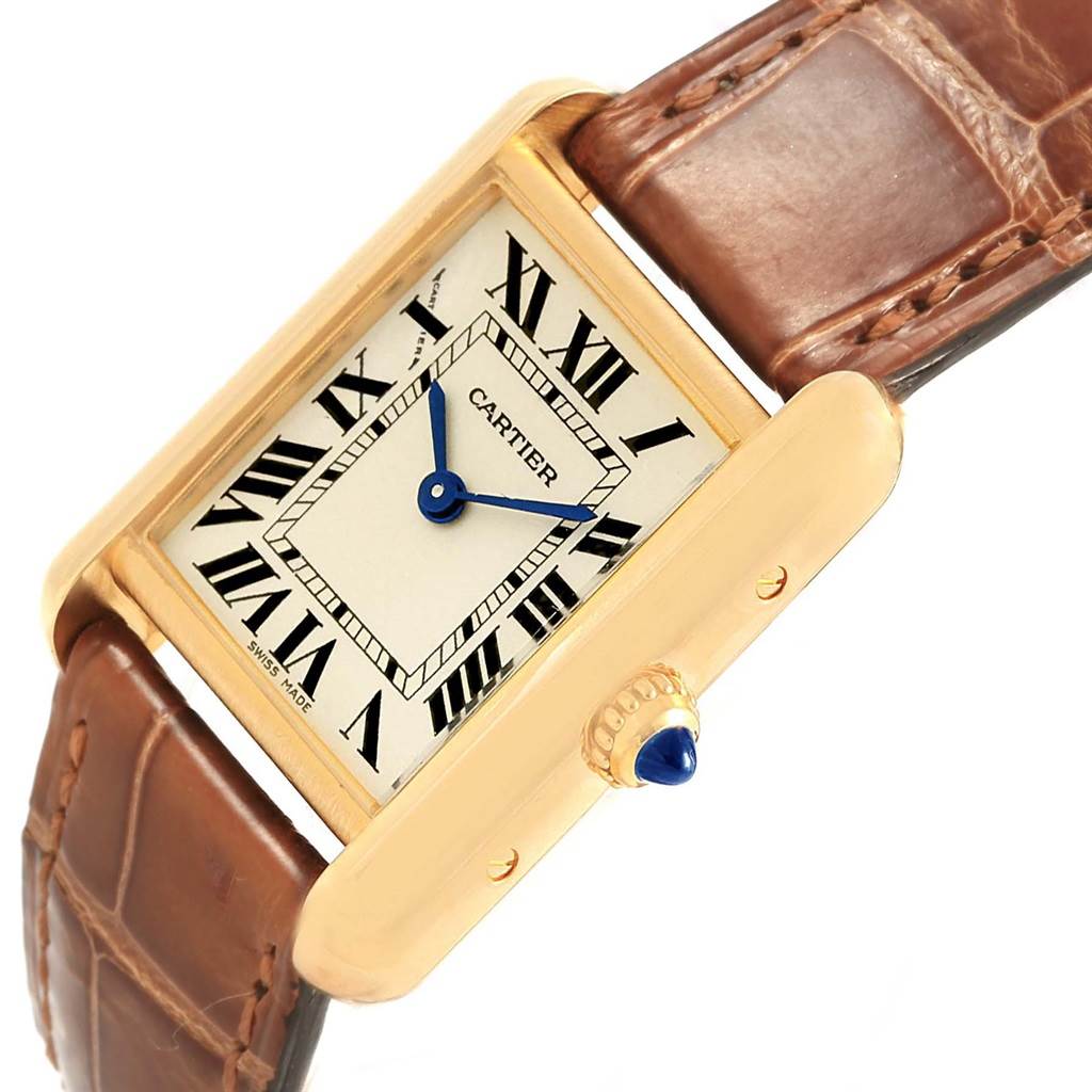 The image shows a close-up angled view of the Cartier Tank Louis W1529856 Women's Yellow Gold Silver Dial W1529856 Women's Yellow Gold Silver Dial watch, highlighting its face, blue hands, and a brown leather strap.