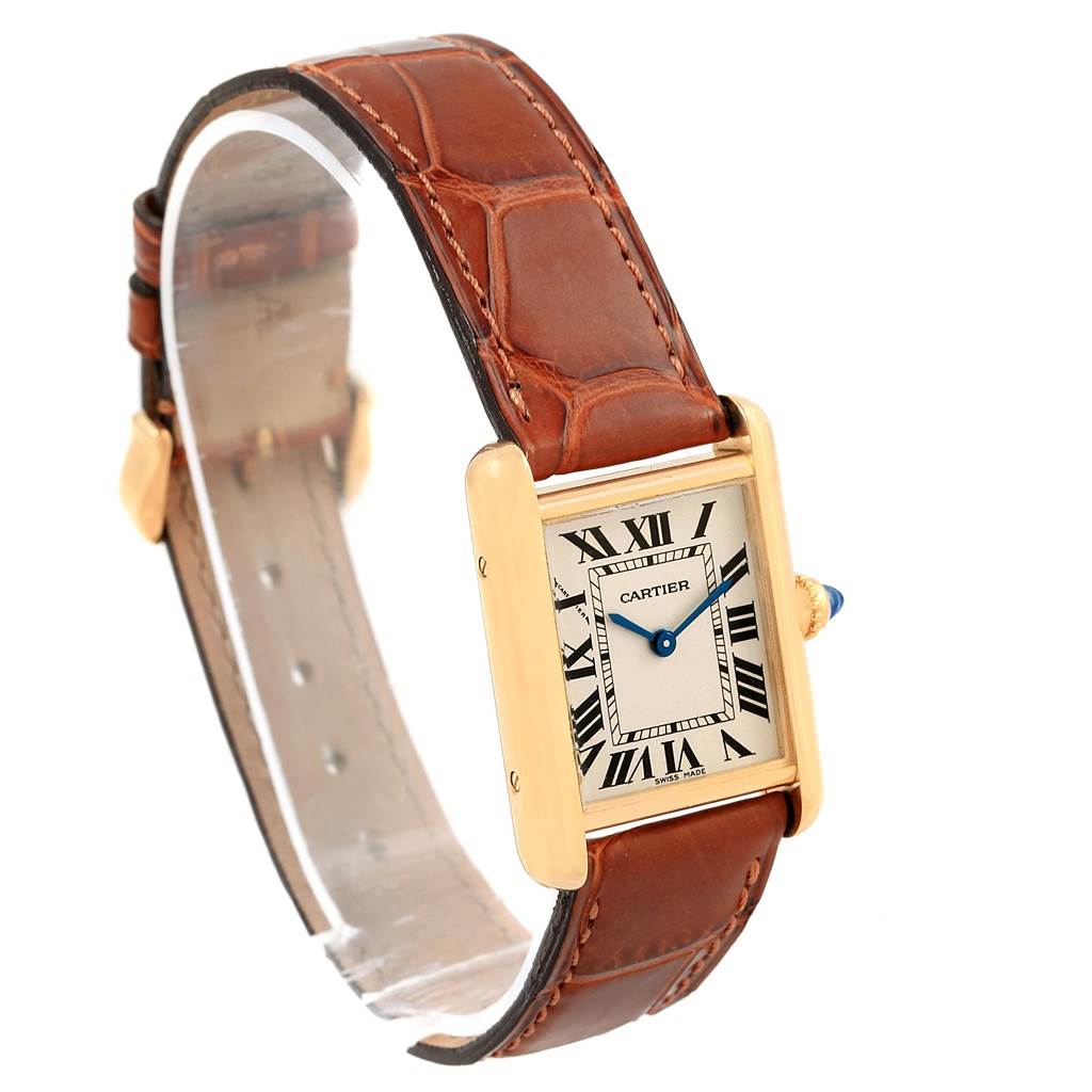 This image shows a Cartier Tank Louis W1529856 Women's Yellow Gold Silver Dial W1529856 Women's Yellow Gold Silver Dial model watch, highlighting its face, brown leather strap, and gold casing at a slightly angled perspective.
