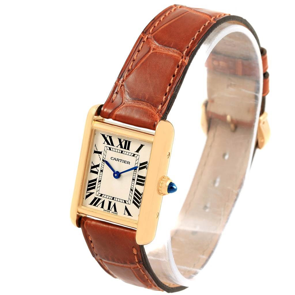 This image shows a Cartier Tank Louis W1529856 Women's Yellow Gold Silver Dial W1529856 Women's Yellow Gold Silver Dial watch at a three-quarter angle, displaying the dial, crown, and brown leather strap.