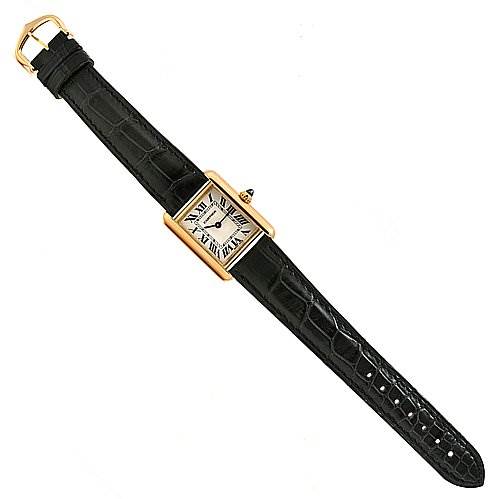 This image shows a top-down view of a Tank Louis watch by Cartier, showcasing its black leather strap and rectangular gold case.