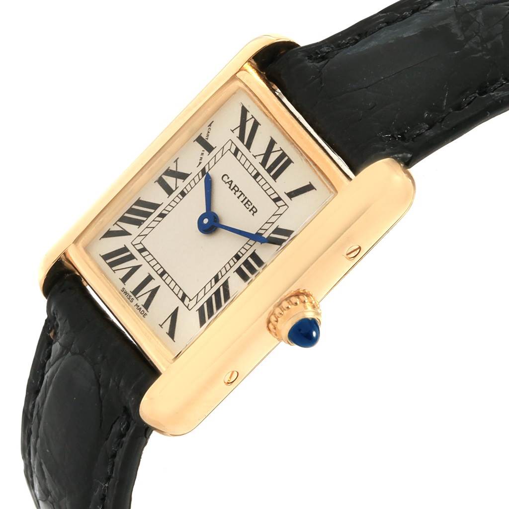 The image shows a Cartier Tank Louis W129856 Women
s Yellow Gold Silver Dial W129856 Women
s Yellow Gold Silver Dial watch at an angled view, highlighting the face, crown, and part of the strap.