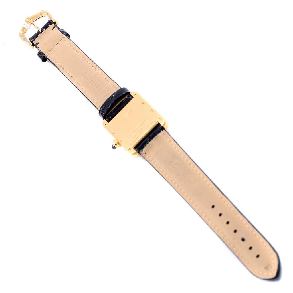 The image shows the back of the Cartier Tank Louis W129856 Women
s Yellow Gold Silver Dial W129856 Women
s Yellow Gold Silver Dial watch with a black leather strap and gold buckle.